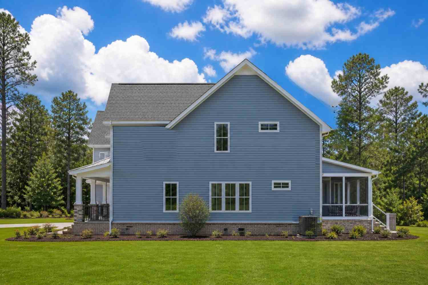 Right Side Elevation of 3 Bedroom 2 Story Gambrel Farmhouse House Plan with Upstairs Lounge